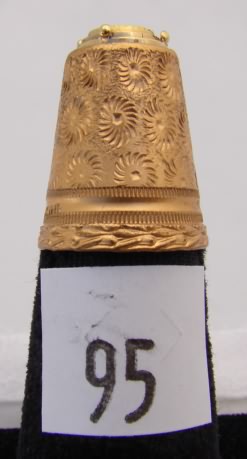 Appraisal: Austria gold tone thimble with black inlay stone inlay and