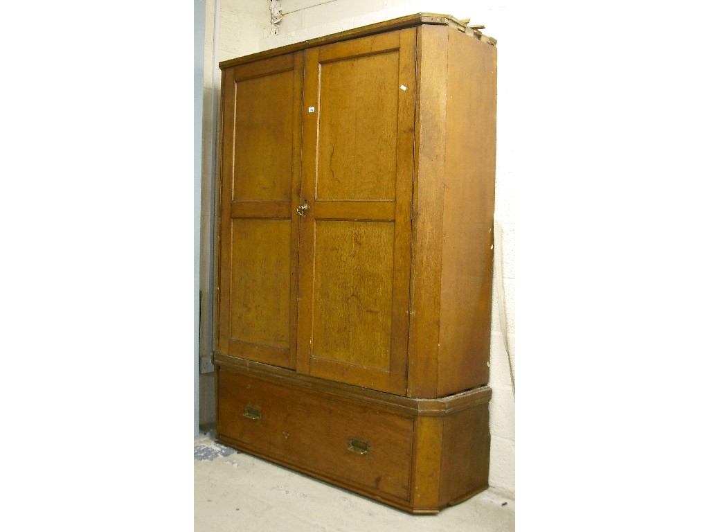 Appraisal: th century golden oak canted cupboard with two panel doors