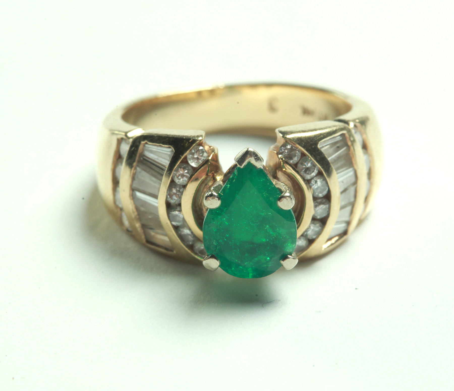 Appraisal: EMERALD AND DIAMOND RING American th century k yellow gold