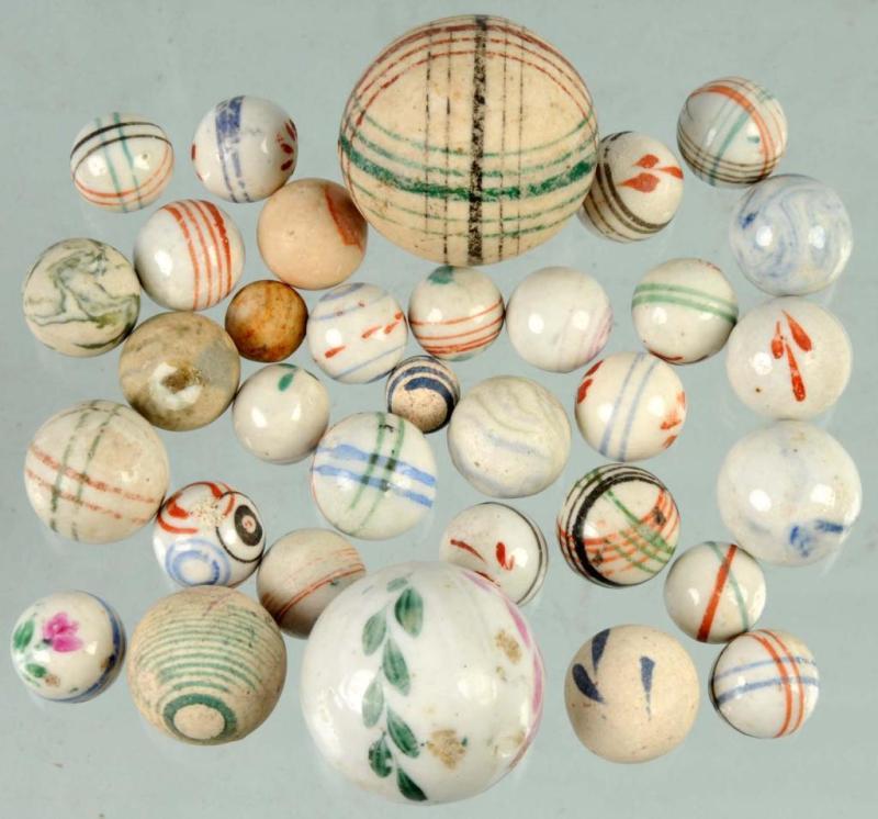 Appraisal: Lot of Hand-Painted China Marbles Description Nice assortment includes one