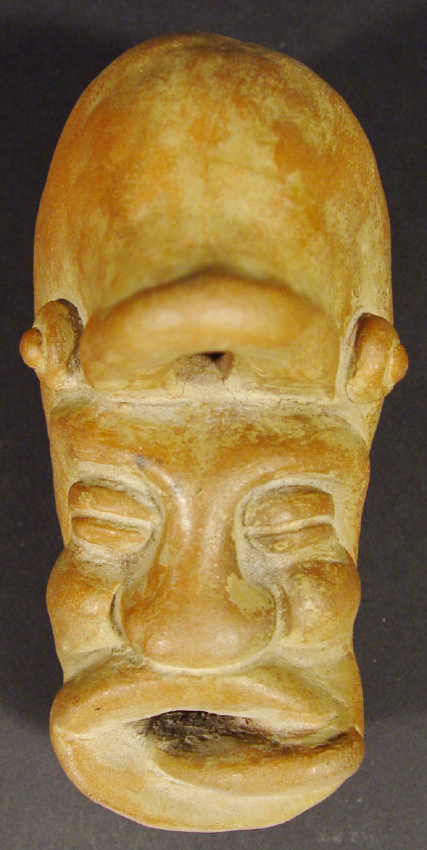 Appraisal: Middle Eastern terracotta inkwell modelled as a mask cm in