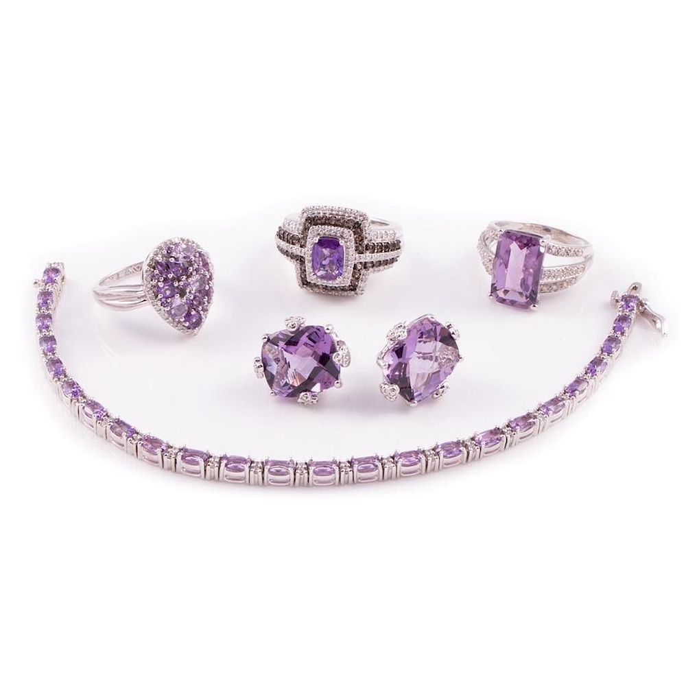 Appraisal: Amethyst diamond and cubic zirconia jewelry comprising three rings a