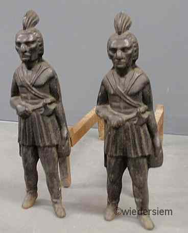 Appraisal: Pair of cast iron standing American Indian andirons probably late