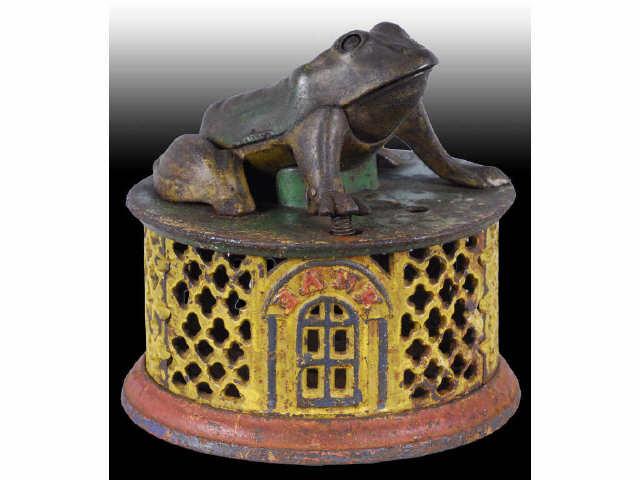 Appraisal: Cast Iron Frog on Lattice Mechanical Bank Description Manufactured by