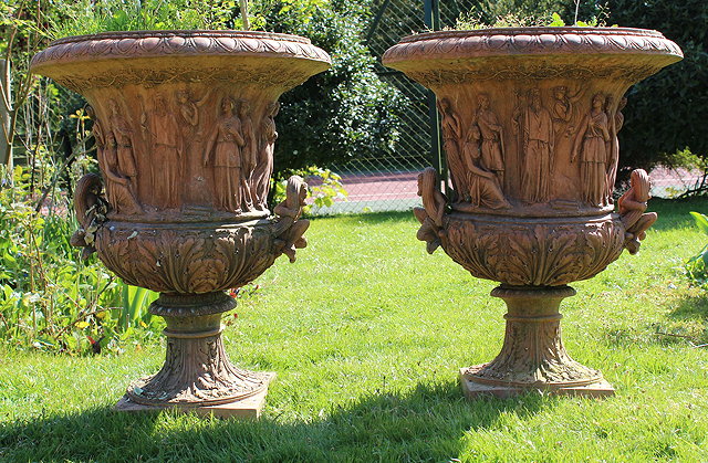 Appraisal: A PAIR OF TERRACOTTA CAMPAGNA URNS of classical form with