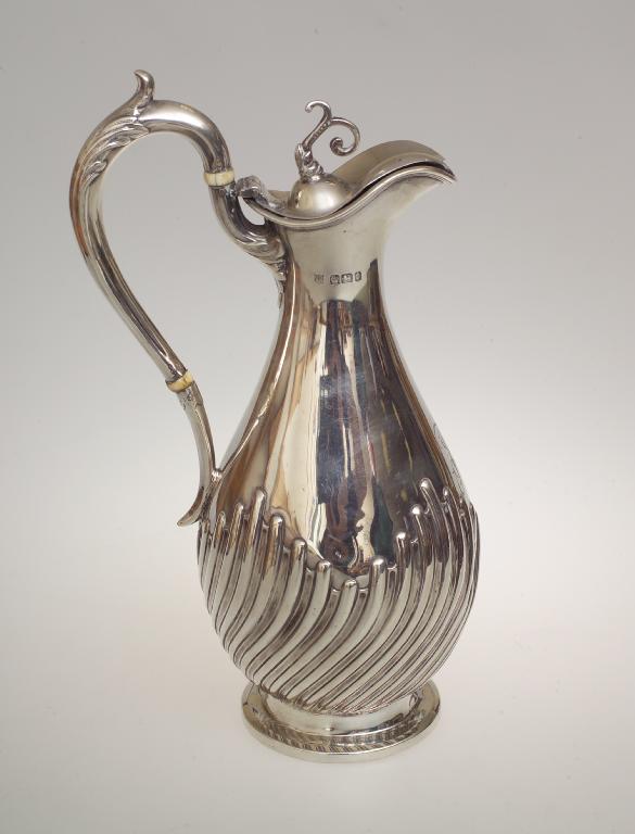 Appraisal: VICTORIAN SILVER CLARET JUG JAMES DEAKIN SONS SHEFFIELD with gadroon-cast