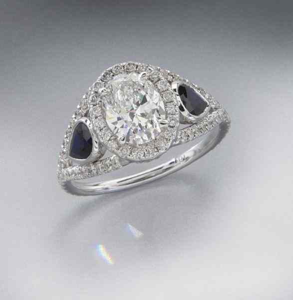 Appraisal: K gold diamond and sapphire ringfeaturing an oval brilliant cut