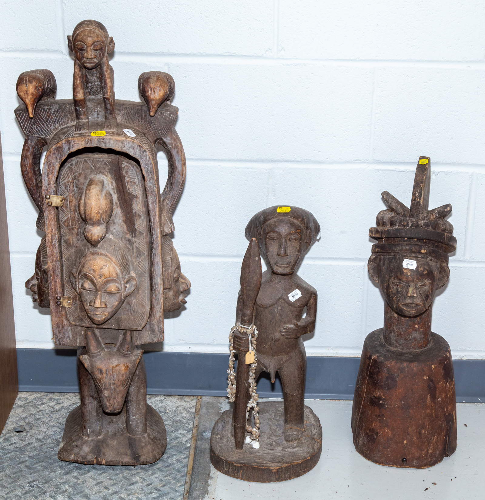 Appraisal: THREE UNUSUAL AFRICAN WOOD CARVINGS th century including a Luba