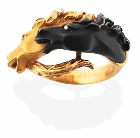 Appraisal: A RING BY CARRERA Y CARRERA The finely detailed horses