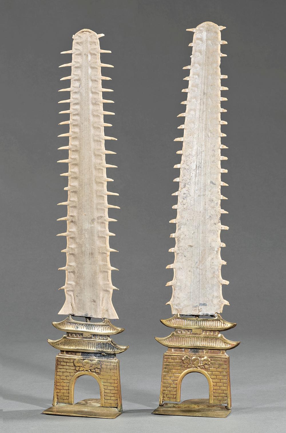 Appraisal: Pair of Sawfish and Brass Bookends rostrum mounted on pagoda-form