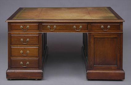 Appraisal: ENGLISH MAHOGANY PARTNER'S DESK The molded top with gold-tooled leather