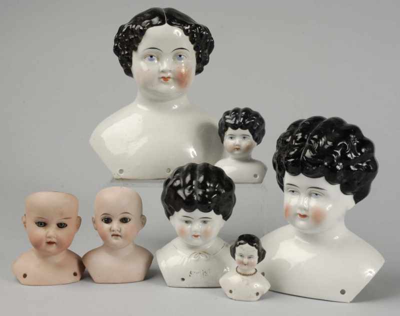 Appraisal: China Bisque Shoulder Doll Heads Description Large s head lots