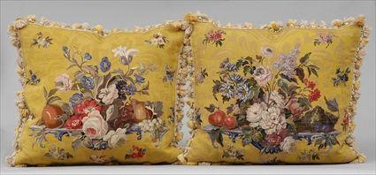 Appraisal: PAIR OF YELLOW-GROUND TAPESTRY PILLOWS Each worked with a colorful