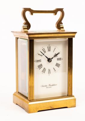 Appraisal: A gilt brass carriage clock by Devon Clocks the dial