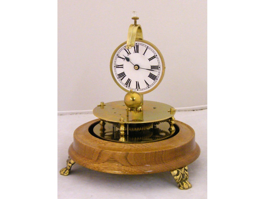 Appraisal: Reproduction of Briggs's conical pendulum clock the white dial supported