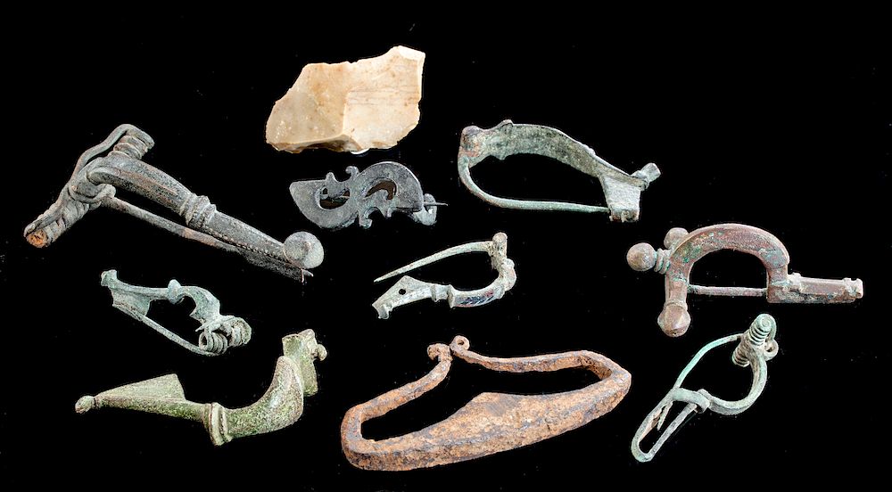 Appraisal: Lot of Roman Bronze Fibulas Iron Flint Striker Roman Imperial