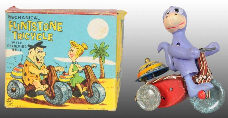 Appraisal: Marx Tin Celluloid Dino Flintstone Tricycle Toy Description Wind-up working