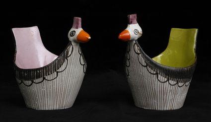 Appraisal: PAIR OF LENCI DESIGN POTTERY HEN-FORM CUPS The one with