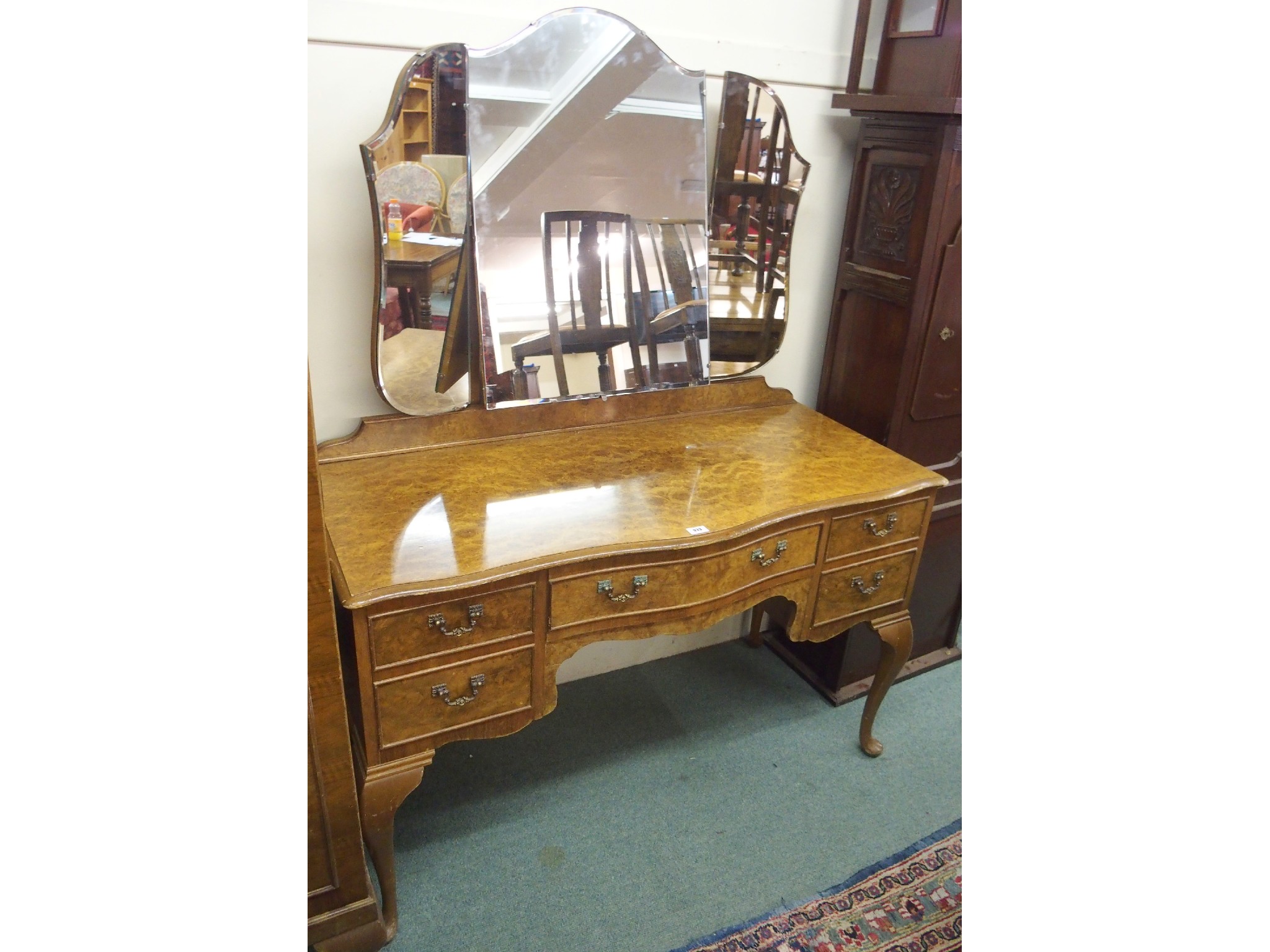 Appraisal: A th Century walnut bedroom suite comprising serpentine dressing table