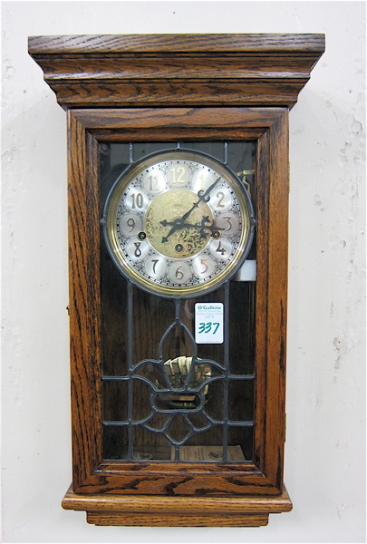 Appraisal: AN OAK CASE WALL CLOCK San Francisco Clock Co style