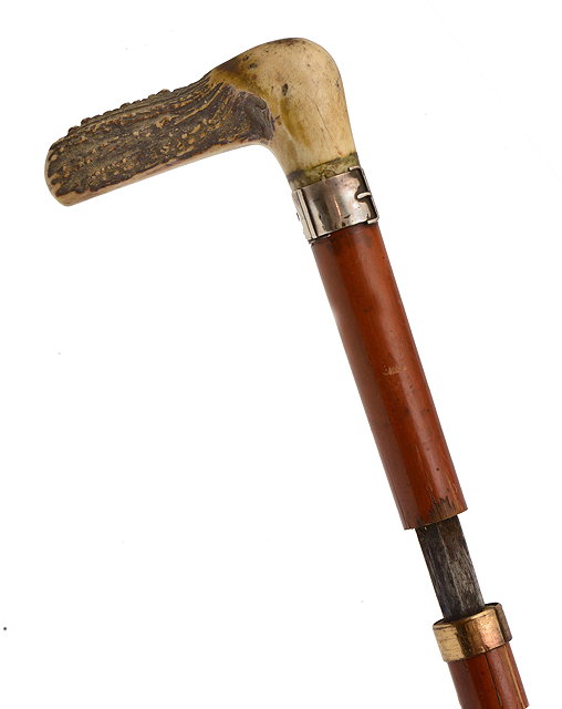 Appraisal: AN EDWARDIAN MALACCA SWORD STICK with stag horn crosshook handle