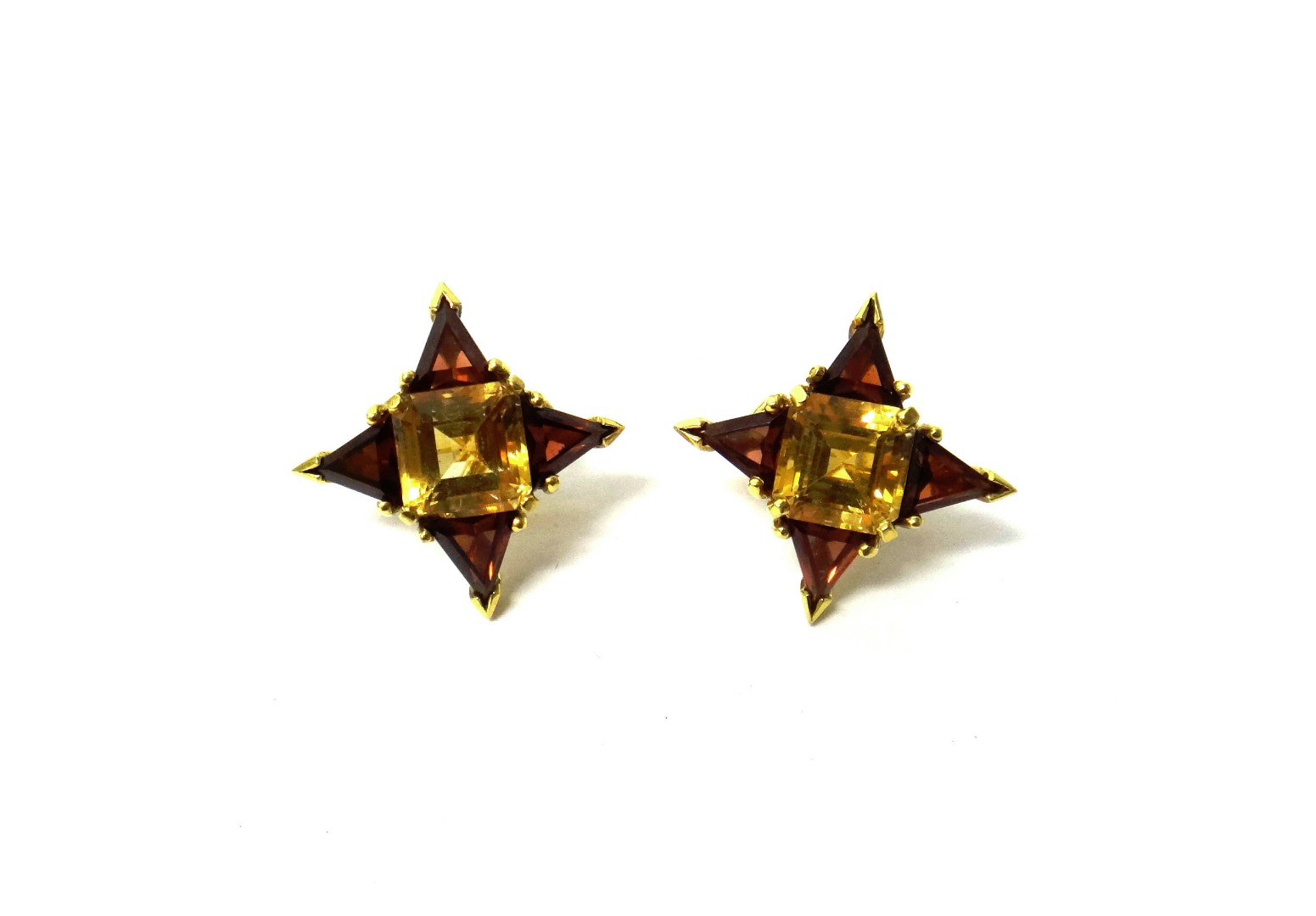 Appraisal: A pair of ct gold citrine and garnet set earclips