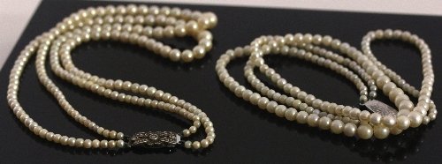 Appraisal: A double-strand cultured pearl necklace with silver clasp and another