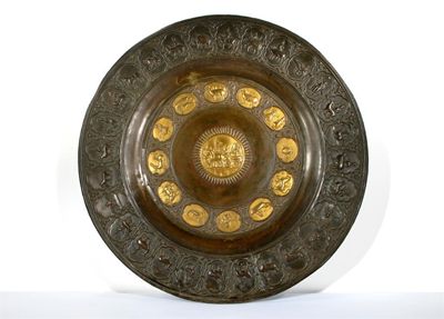 Appraisal: A massive Indian copper dish decorated with gilt panels one