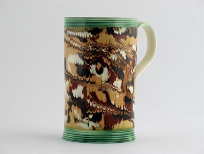 Appraisal: A good mochaware cylindrical mug decorated in brown cream and