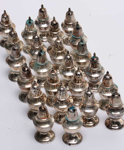 Appraisal: A COLLECTION OF TWENTY TWO MINIATURE SILVER PEPPERETTES stamped Hong