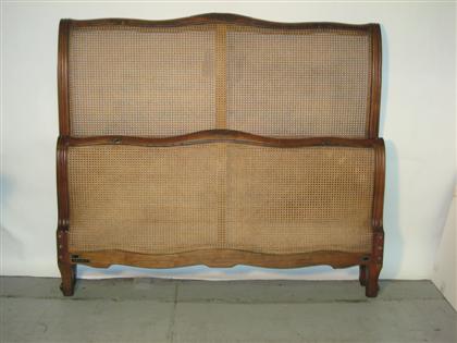 Appraisal: Full size walnut and cane sleigh bed th century H