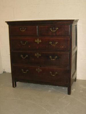 Appraisal: AN OAK CHEST with moulded frieze two short over three