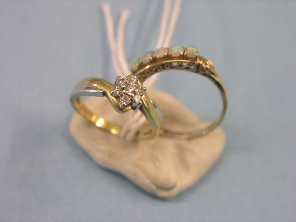 Appraisal: An ct gold ring five opals within carved setting ring