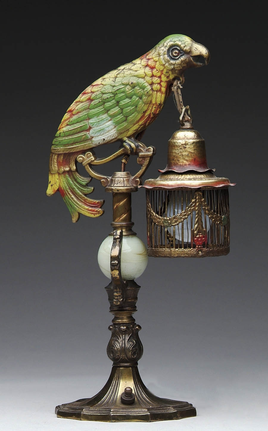 Appraisal: UNUSUAL BRONZE PARROT TABLE LAMP Coal painted colorful parrot holds