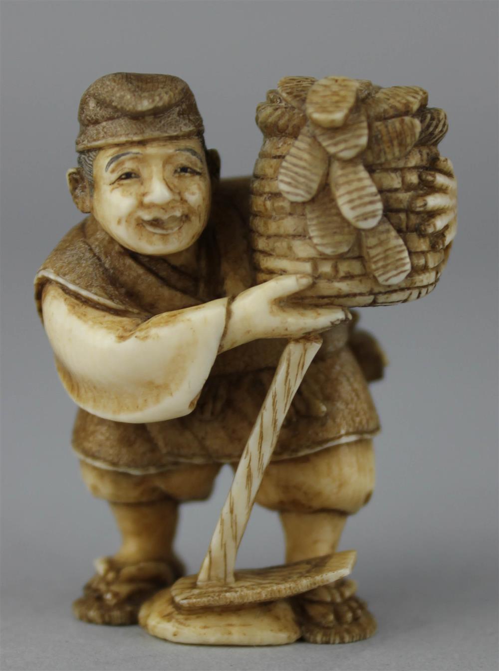 Appraisal: IVORY NETSUKE OF A FARMER WITH HIS HOE AND BASKET