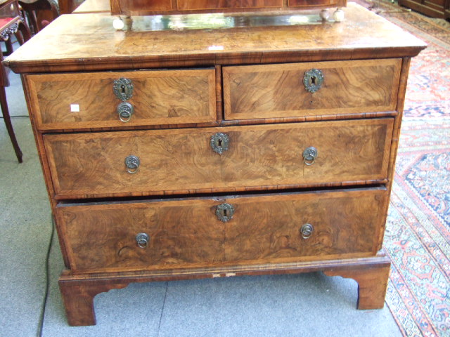 Appraisal: An th century and later walnut chest with feather banded