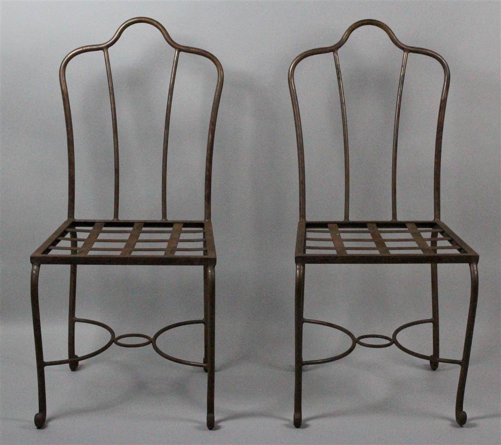 Appraisal: PAIR OF PATINATED IRON GARDEN SIDE CHAIRS shaped crest above