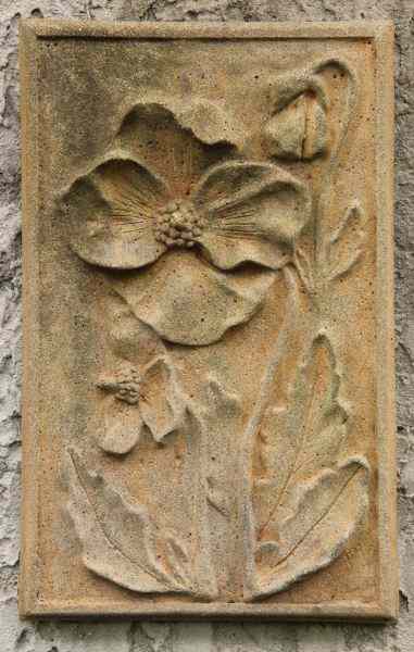 Appraisal: Cast Stone Garden Plaquefeaturing poppies x in