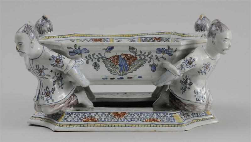 Appraisal: FRENCH FAIENCE CENTERPIECE IN THE R GENCE STYLE The bowl