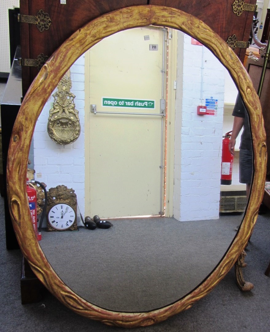 Appraisal: A th century gilt framed oval wall mirror with moulded