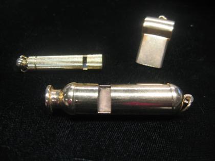 Appraisal: Three whistles two karat yellow gold All in different styles