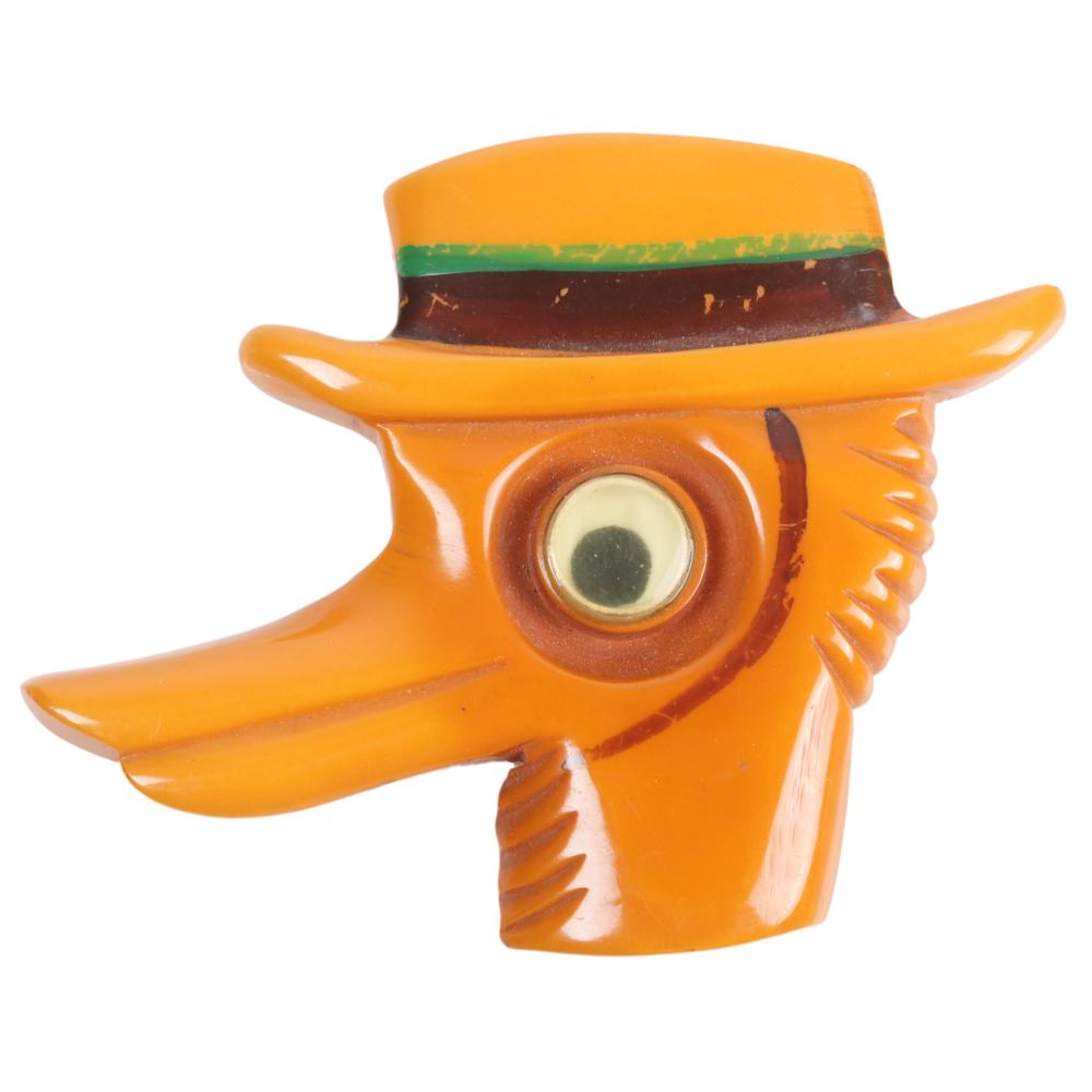 Appraisal: BAKELITE GOOGLY EYE CARVED AND PAINTED DUCK IN HAT PIN