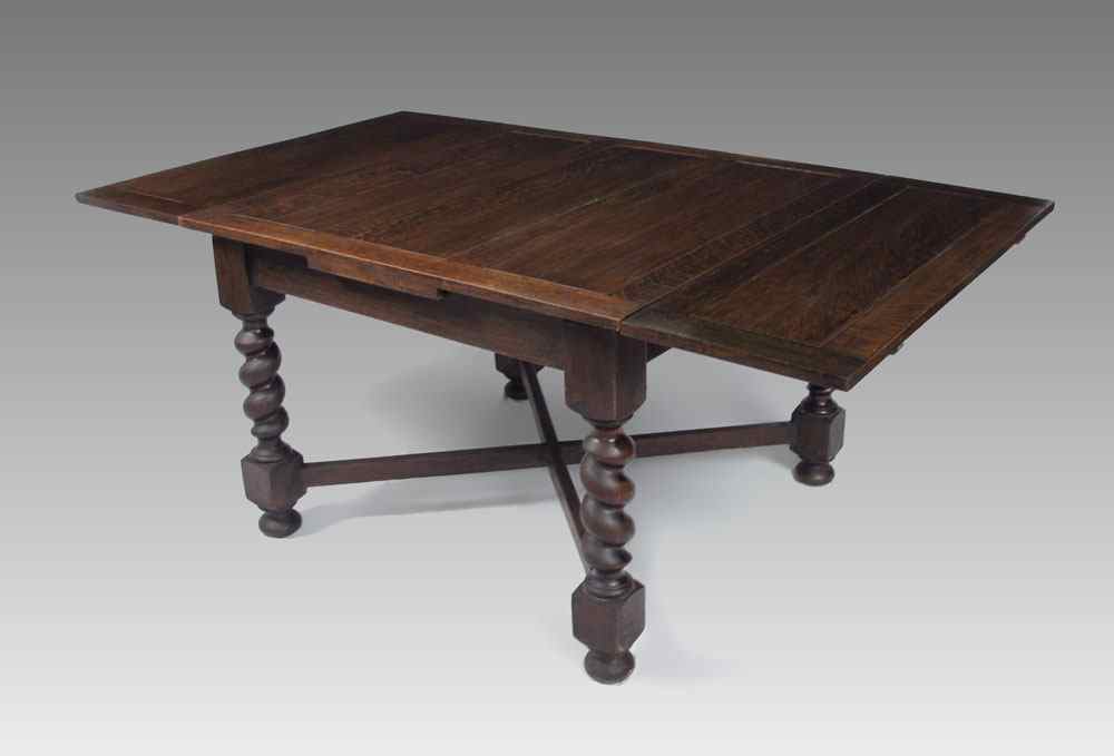 Appraisal: ENGLISH OAK DRAW LEAF BARLEY TWIST TABLE Paneled top over