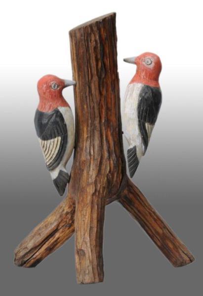 Appraisal: Wooden Woodpeckers Decoy on Tree Base Condition Excellent Size T