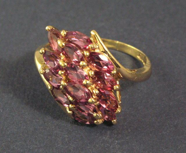 Appraisal: DIAMOND AND FOURTEEN KARAT GOLD RING centering around brilliant-cut cognac