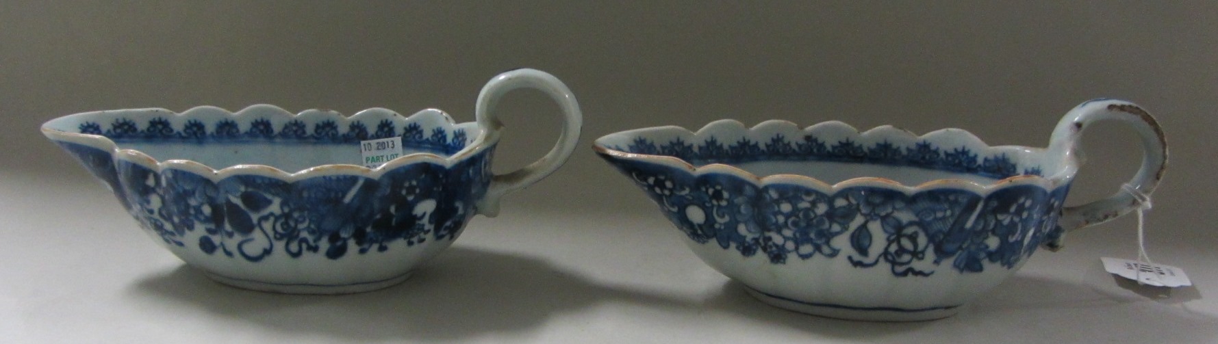 Appraisal: A pair of Chinese export blue and white sauceboats Qianlong