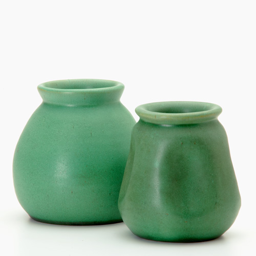 Appraisal: TECO Two bulbous vases in matte green glaze Both marked