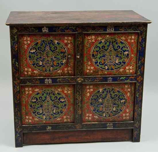 Appraisal: Tibetan painted cabinet Tibetan painted cabinet enclosed by four doors