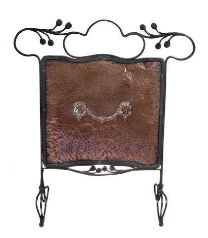 Appraisal: AN ART NOUVEAU WROUGHT IRON AND EMBOSSED COPPER FIRESCREEN