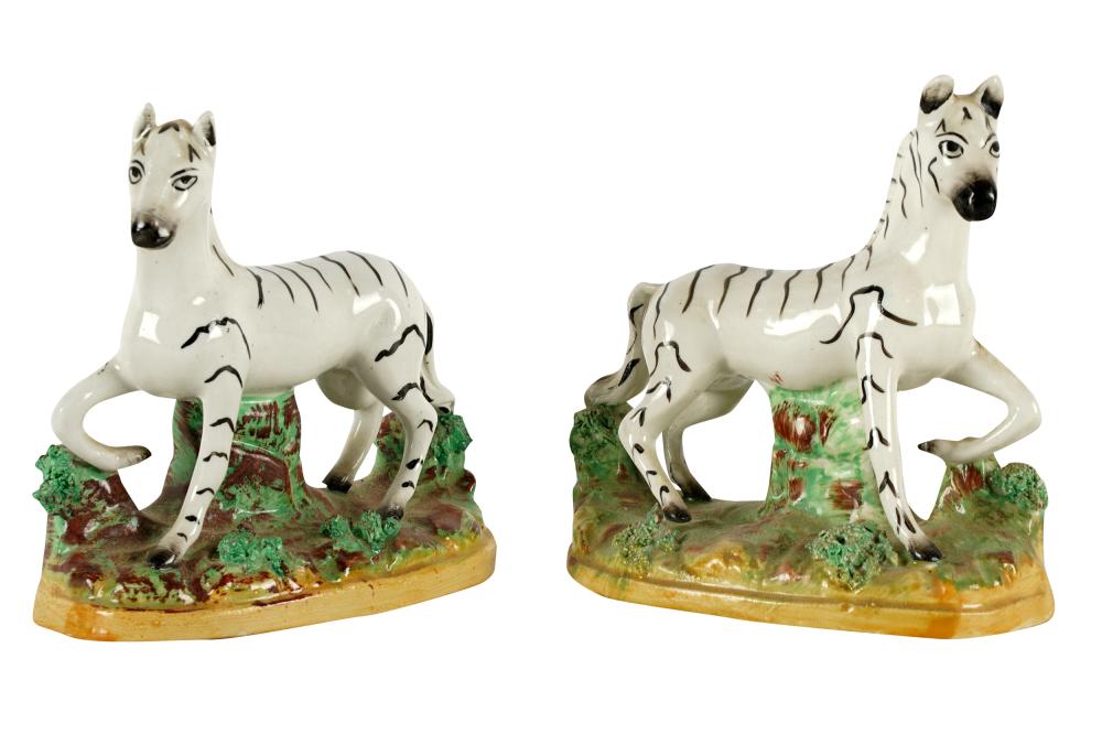 Appraisal: PAIR OF STAFFORDSHIRE ZEBRASeach with printed Staffordshire England and knot